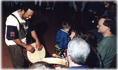 Leon Mobley facillitating drum circle at Noisy Toys